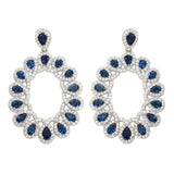 Sterling Silver Rhodium Plated Open Oval Shaped Hanging Earrings With Blue And Clear CZ