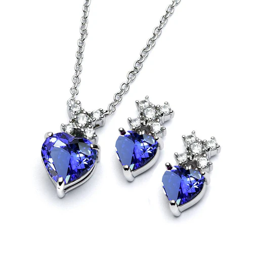 Sterling Silver Rhodium Plated Clear Round And Birthstone Heart Tanzanite CZ Stud Earring And Necklace Set