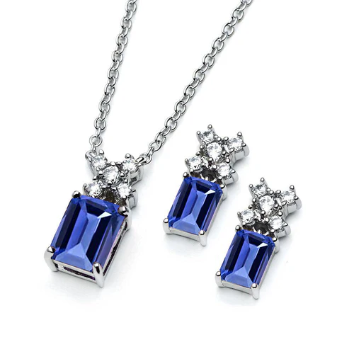 Sterling Silver Rhodium Plated Round And Birthstone Rectangle Tanzanite And Clear CZ Stud Earring And Necklace Set