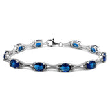 Sterling Silver Rhodium Plated Blue Oval CZ Tennis Bracelet