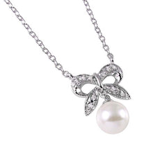 Load image into Gallery viewer, Sterling Silver Rhodium Plated CZ Encrusted Bow with Hanging Synthetic Pearl