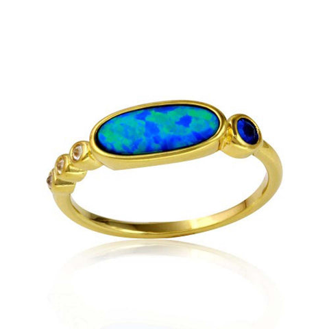 Sterling Silver Gold Plated Round And Oval Shaped Ladies Ring With Blue And Clear CZ