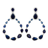 Sterling Silver Rhodium Plated Teardrop With Open Hanging Graduated Earrings With Blue And Clear CZ
