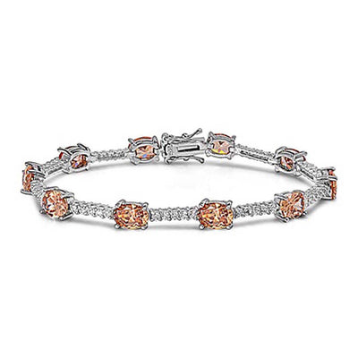 Sterling Silver Elegant Bracelet Oval Prong Set with Champagne Cz and Five Round Clear Czs in BetweenAnd Length of 7.5  Stone Size: 7x5MM