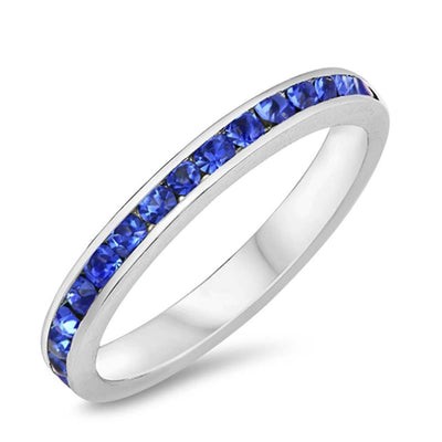 Sterling Silver Eternity Band Ring with Blue Sapphire Simulated Crystals on Channel Setting with Rhodium FinishAnd Band Width 3MM