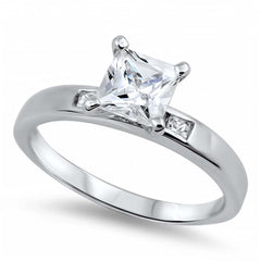 Sterling Silver Princess Cut Clear Solitaire CZ Engagement Ring on Prong Setting with Small Channel Setting Side View CZ with Rhodium Finish, Face Height of 7mm