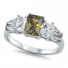 Load image into Gallery viewer, Sterling Silver Elegant Ring Three Radiant Cut Peridot Cz on Center and Clear Cz on Both Side with Tapered BaguetteAnd Face Height of 7MM