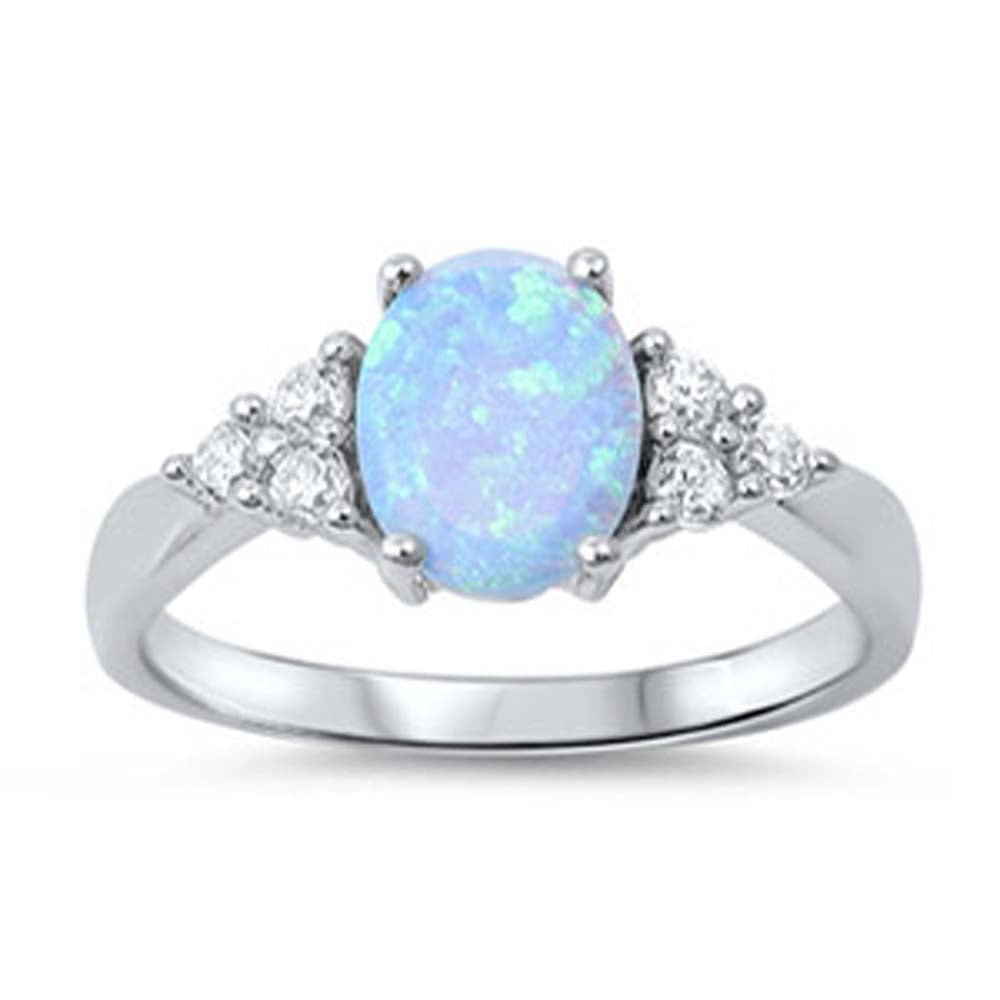 Sterling Silver Fancy Style Band Inlaid with Clear Czs with Solitaire Oval Cut Light Blue OpalAnd Face Height of 9MM
