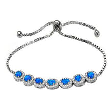 Load image into Gallery viewer, Sterling Silver Simulated Blue Opal Adjustable Halo Rhodium Bracelet